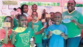  ?? CONTRIBUTE­D ?? Students from Beecham Hill Primary and Infant School in Flint River, St Mary, with their numeracy coordinato­r, Cyreta Henry (right), at a numeracy fair last week.