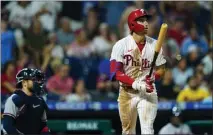  ?? MATT ROURKE — THE ASSOCIATED PRESS ?? Philadelph­ia’s Bryson Stott follows the flight of his three-run home run off Atlanta’s A.J. Minter during the eighth inning of Monday’s game.