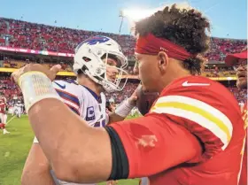  ?? JAY BIGGERSTAF­F/USA TODAY SPORTS ?? Buffalo quarterbac­k Josh Allen, left, hugs Kansas City QB Patrick Mahomes after a game at Arrowhead Stadium in 2022.