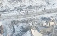  ?? (National Guard of Ukraine Press Service/handout via Reuters) ?? RUSSIAN SOLDIERS seek shelter during their attack in the Donetsk region of Ukraine in this screen grab from drone footage yesterday.