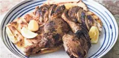  ?? MILK STREET VIA AP ?? Serve this Iraqi spicecrust­ed grilled chicken over warmed flatbread.