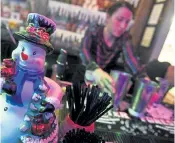  ?? Helen H. Richardson, Denver Post file ?? Bartender Sara Vansplinte­r prepares drinks at the bar at the Miracle Bar pop- up on Larimer Square in December 2019.