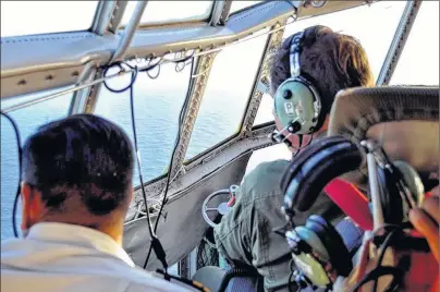  ?? ARGENTINE NAVY VIA AP ?? In this photo released by the Argentine Navy on Wednesday, members of the Argentine Air Force search for a missing submarine in the South Atlantic near Argentina’s coast. Argentine families of 44 crew members aboard a submarine that has been lost in...