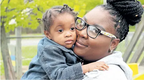  ?? CHERYL CLOCK/POSTMEDIA NEWS ?? Toni-Ann Smikle, 21, and her two-year-old daughter, Tiana. Toni-Ann is part of a pilot program in Niagara that promotes the importance of infant mental health. They are pictured in St. Catharines on Tuesday.