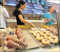  ??  ?? IN THIS CASE, the early bird gets full pick of the goodies at the Donut Bar, which frequently sells out of the day’s treats.