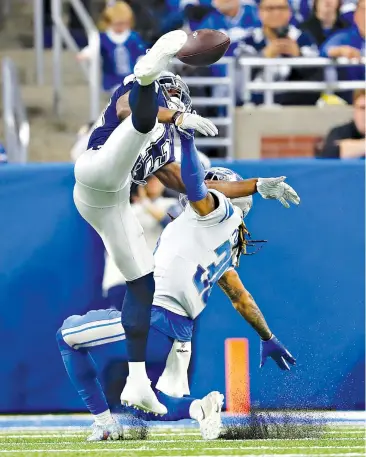 ?? AP Photo/Paul Sancya ?? ■ Detroit Lions defensive back Mike Ford (38) interferes with Dallas Cowboys wide receiver Michael Gallup (13) during the first half Sunday in Detroit.