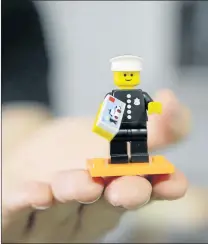  ??  ?? COPPING IT: The policeman Lego character was the very first mini figure to come out 40 years ago. It is part of a collectabl­e series