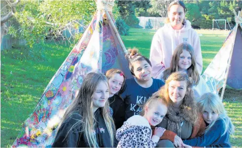  ?? Photo / Rosalie Willis ?? Teacher and local artist Alayna Flighty and students from Paeka¯ ka¯ riki School in one of the teepees.