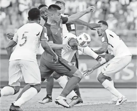  ?? REBECCA BLACKWELL, AP ?? Bobby Wood, center, controls the ball before scoring the USA’s tying goal against Honduras. A loss would have hurt U.S. chances of reaching the World Cup.