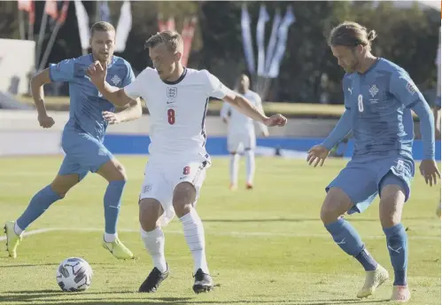  ?? PICTURE: HARALDUR GUDJONSSON/AFP ?? 0 England midfielder James Ward-prowse shields the ball from Iceland’s penalty villain Birkir Bjarnason.