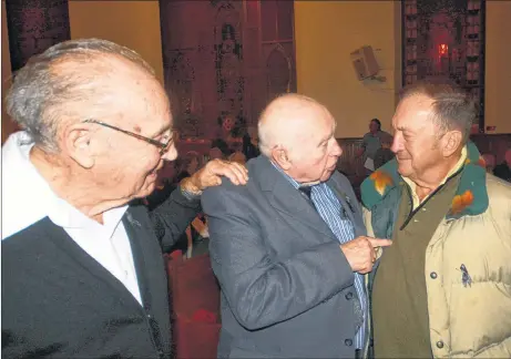  ?? DAVE MATHIESON/AMHERST NEWS ?? Hilton McNutt, left, who was a draegerman in the 1958 Springhill Bump, speaks with survivor Harold Brine and Bill Kempt, whose late father survived the disaster, during a hymn sing at St. Andrew’s-Wesley United Church in Springhill on Oct. 23. The event marked the 60th anniversar­y of the disaster that took the lives of 75 coal miners.