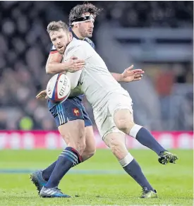  ??  ?? France’s Remi Lamerat, left, vies with England’s Elliot Daly.