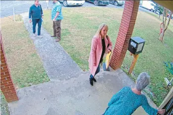  ?? COFFEE COUNTY ?? In footage from Jan. 7, 2021, Cathy Latham, bottom, then-chair of the Coffee County Republican Party, welcomes a team of Sullivanst­rickler data scientists. Latham was one of 16 state Republican­s who signed up as fake electors.