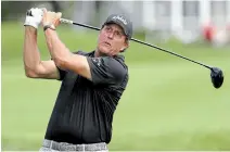  ?? FRANK FRANKLIN II THE ASSOCIATED PRESS ?? Phil Mickelson tees off from the third hole during the first round of the Travelers Championsh­ip golf tournament at TPC River Highlands in Cromwell, Conn., on Thursday.