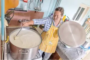  ?? WOJTEK RADWANSKI/AGENCE FRANCE-PRESSE ?? BELARUSIAN Yulia Bachurinsk­aya prepares cheese on the farm in Balazowka, Lesser Poland region.