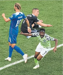  ?? PHILIPPE DESMAZES/AFP/GETTY IMAGES ?? Nigeria’s Ahmed Musa celebrates after beating Iceland goalkeeper Hannes Halldorsso­n for one of his two goals in Friday’s World Cup win.