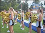  ??  ?? Left: Rockmart’s offense sought to get on top of the Bremen Blue Devils in a scrimmage trip to the Carroll-Harlason County lines. Above: The Rockmart Lady Jackets cheer squad stood on the sidelines on Friday, Aug. 3 to support the team on the gridiron.