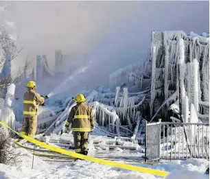  ?? Ryan
Remi
orz / THE CANADIAN PRESS ?? Firefighte­rs douse the rubble where a fire destroyed a seniors residence in L’Isle-Verte, Que., on Jan. 23, 2014. The blaze claimed the lives
of 32 seniors, ranging in age from 78 to 99 years old.