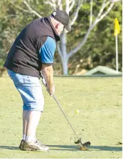  ??  ?? Glenn Whelan of Bunyip plays a chip shot towards the 10th green during the stableford competitio­n.