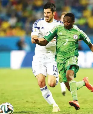  ?? Photo: AFP ?? Nigeria’s forward Ahmed Musa (R) challenges BosniaHerc­egovina’s midfielder Mensur Mujdza during the Group F football match at the Pantanal Arena in Cuiaba during the 2014 FIFA World Cup on June 21, 2014.