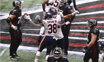  ??  ?? The Chicago Bears celebrate after a game clinching intercepti­on. Photograph: Curtis Compton/AP
