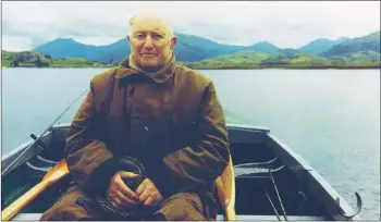  ??  ?? John ‘Ton’ MacDonald enjoys a sail on Loch Shiel in his 90s.