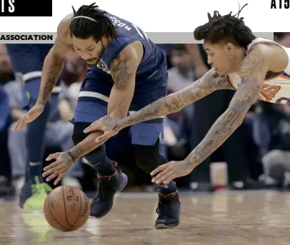  ?? —AP ?? Minnesota’s Derrick Rose and Phoenix’s Kelly Oubre Jr. chase the loose ball.