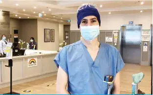  ??  ?? LONGUEUIL: Dr Etienne Desilets, a gastroente­rologist, poses in Montreal on April 30, 2020. Desilets has been working part-time since April 19, at Chartwell Residence, a nursing home in Longueuil, south of Montreal Quebec, to help nurses. — AFP