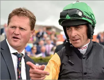  ??  ?? Trainer Colin Bowe with jockey Davy Russell after a win for Shantou Flyer in Galway in 2015.