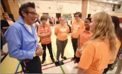  ??  ?? Margaret Avenue Public School students talk to residentia­l school survivor Geronimo Henry.