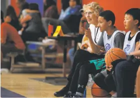  ??  ?? Left: Piper and Michael at a July basketball game at the Boys & Girls Club in South San Francisco.