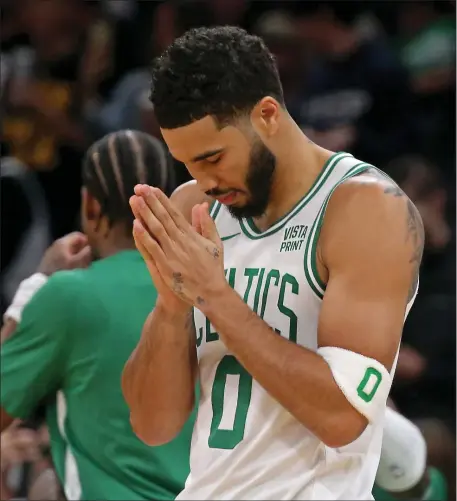  ?? STAFF PHOTO — STUART CAHILL/BOSTON HERALD ?? Celtics forward Jayson Tatum prays before Tuesday’s preseason game against the New York Knicks at the TD Garden.