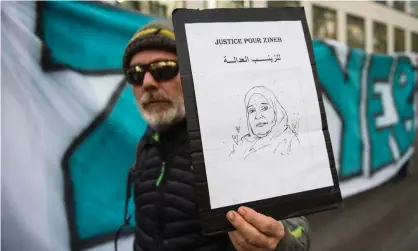  ?? Photograph: Clement Mahoudeau/AFP via Getty Images ?? A protester holds a portrait of Zineb Redouane during a march in Marseille in November last year.