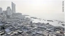  ??  ?? An oceanfront slum in Mumbai: Millions in Asia’s megacities have little choice but to reside in informal settlement­s on the fringes of society.