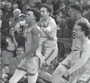  ?? Rick Scuteri Associated Press ?? ARIZONA STATE’S Desmond Cambridge Jr., left, celebrates with teammates after his buzzer-beater.