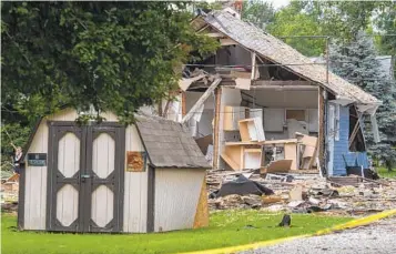  ?? MACABE BROWN EVANSVILLE COURIER & PRESS VIA AP ?? Emergency crews respond to a house explosion in Evansville, Ind., on Wednesday. Officials said there were three fatalities and more than 39 other homes were damaged from the blast.