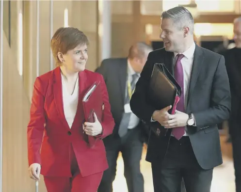  ??  ?? 0 First Minister Nicola Sturgeon, Derek Mackay and the SNP leadership were defeated at conference on a post-independen­ce currency