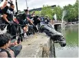  ??  ?? Demonstrat­ors dump the statue of Edward Colston in Bristol Harbour on June 7