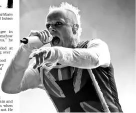  ??  ?? File photo taken on Aug 13, 2015 shows members of the British band The Prodigy, Liam Howlett (right), Keith Flint (centre), and Maxim (left) posing prior to an interview in Tokyo. - Keith Flint died at the age of 49 and (right) Flint performs at the 10th annual Incheon Pentaport Rock Festival in Incheon, west of Seoul on Aug 9, 2015. — AFP photos