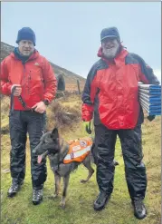  ?? (Pic: Marian Roche) ?? Niall Devery and Mike Palmer with Croía, a ‘puppy’ who spent the morning training recently. Mike spent some time lying on the ground as a ‘dog body’, waiting to be sniffed out.