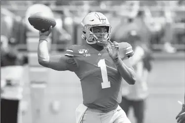  ?? AP/JAY LAPRETE ?? Ohio State quarterbac­k Justin Fields throws a pass against Florida Atlantic on Saturday in Columbus, Ohio.