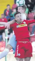  ??  ?? Head boy: United’s Jonny Addis gets the better of Ryan Curran