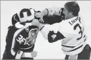  ?? JOHN KENNEY/ GAZETTE FILES ?? Jonathan St-Louis of the Verdun Dragons and Corey Laniuk of the Laval Chiefs go at it during an LNAH game in 2004.