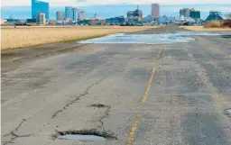  ?? WAYNE PARRY/AP ?? A runway at the former Bader Field airport with casinos in the background Feb. 18 in Atlantic City, N.J. A proposal for the former airport site includes housing and canals.