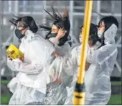 ?? AFP ?? Women walk in heavy rains as Typhoon Haishen hits Kagoshima in Japan’s Kagoshima prefecture.