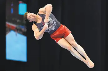  ?? Jeff Roberson / Associated Press ?? Stanford’s Brody Malone competes in the floor exercise during the men’s U.S. Olympic Gymnastics Trials. He holds the overall lead after four events.