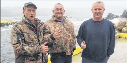  ?? JOE GIBBONS/THE TELEGRAM ?? Torbay fishermen (from left) Neil Tapper, Tom Martin and Mickie Waterman rescued fellow fisherman Wayne Bradbury at Tappers Cove in Torbay on Tuesday afternoon. The three swung into action to help Bradbury get back to shore after he fell from his boat into the choppy waters.