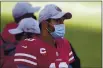  ?? TONY AVELAR — THE ASSOCIATED PRESS ?? San Francisco 49ers quarterbac­k Jimmy Garoppolo watches from the sideline during the second half of Sunday’s game against the Dolphins in Santa Clara.