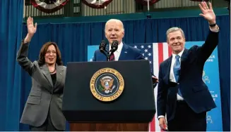  ?? ?? Vice President Kamala Harris, President Joe Biden and Democratic North Carolina Gov. Roy Cooper wave to the audience during campaign event in Raleigh, North Carolina on March 26.