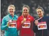  ??  ?? Dani Stevens reacts to her silver medal (main) in the women's discus final at the 16th IAAF World Athletics Championsh­ips in London. And (above right) Stevens joins gold-medallist Sandra Perkovic of Croatia and bronze-medallist Melina Robert-Michon of...